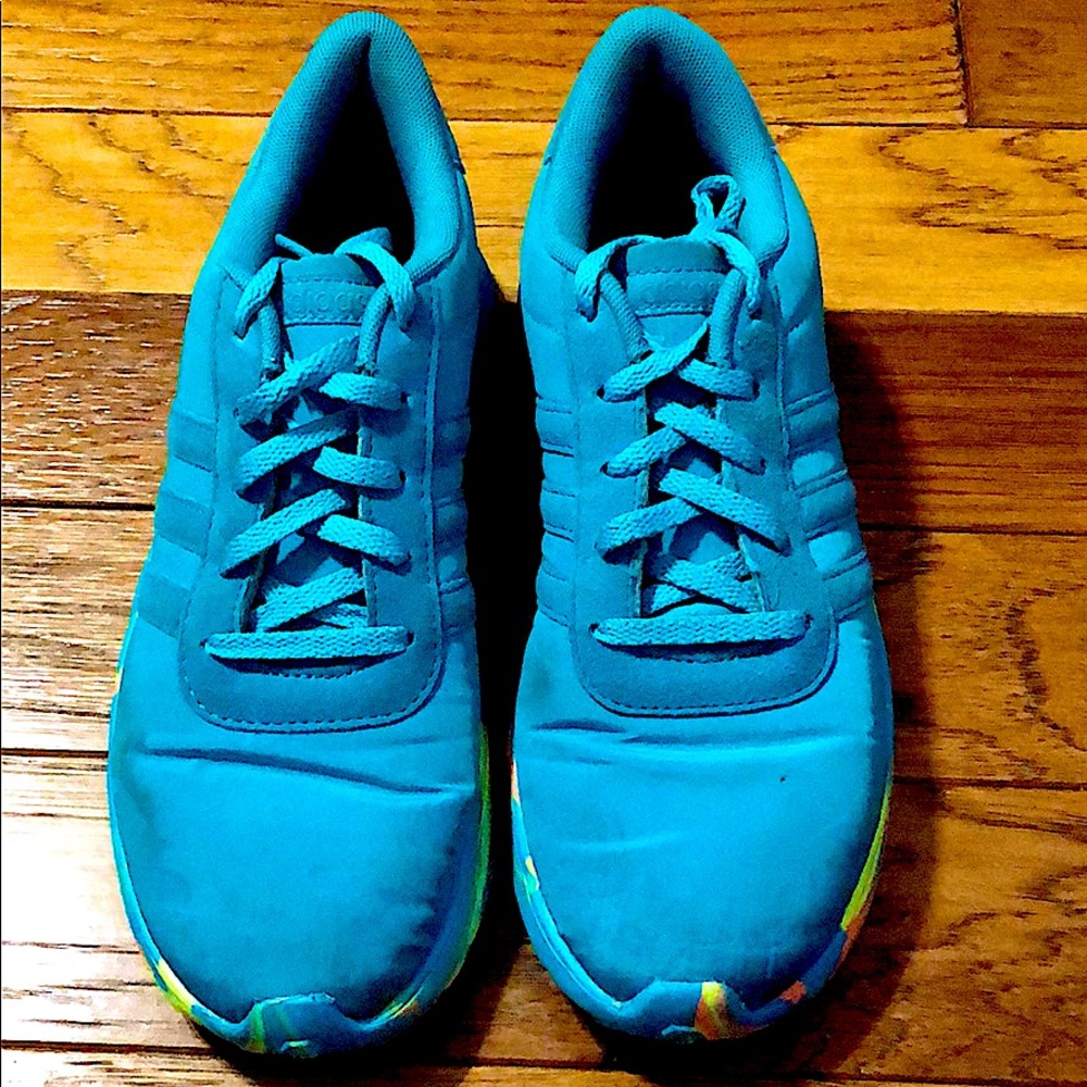 Turquoise Adidas shoe with multicolor bottom